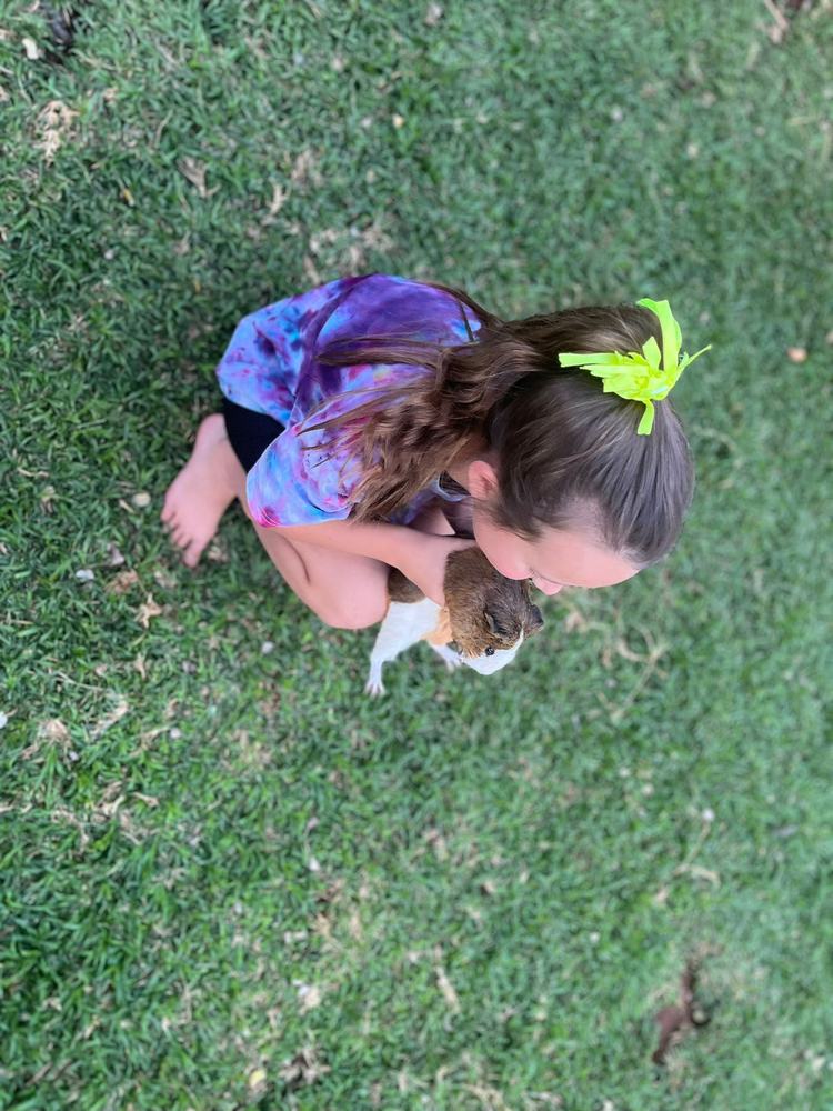 Child holding a cat